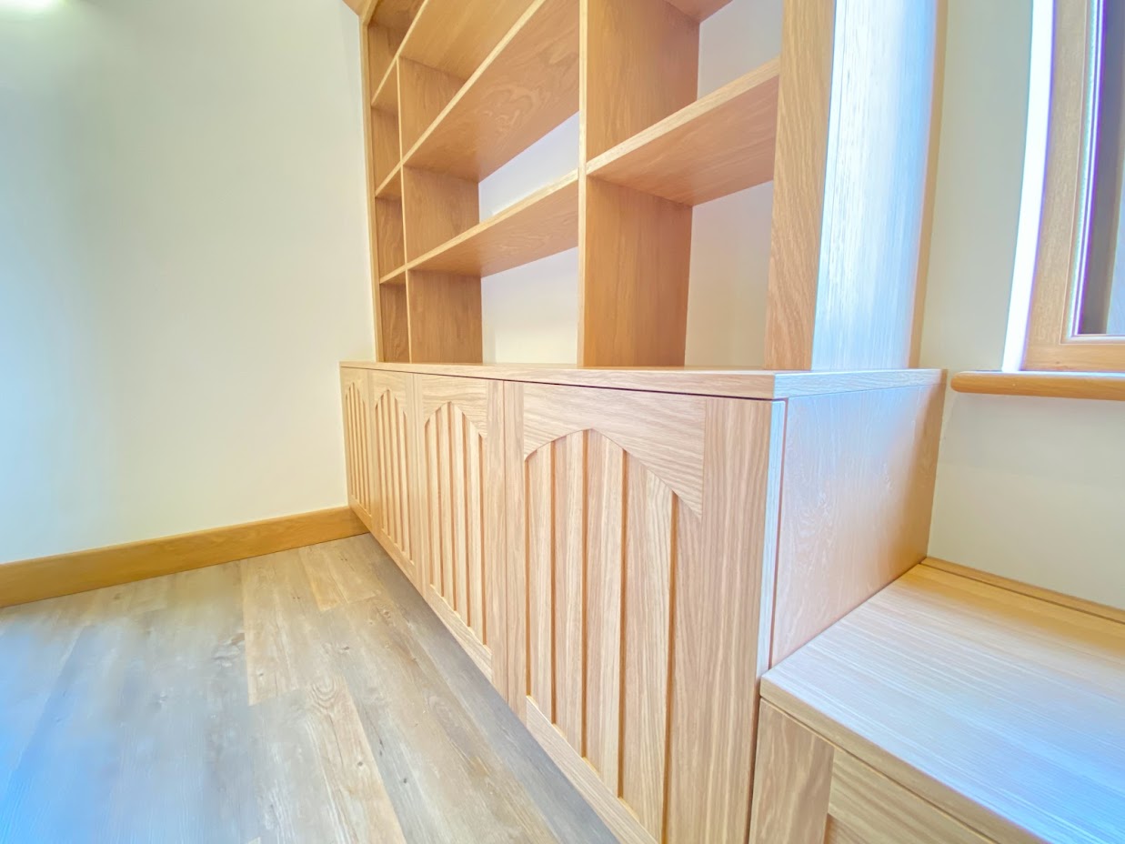 Bespoke oak cabinetry with detailed panelling