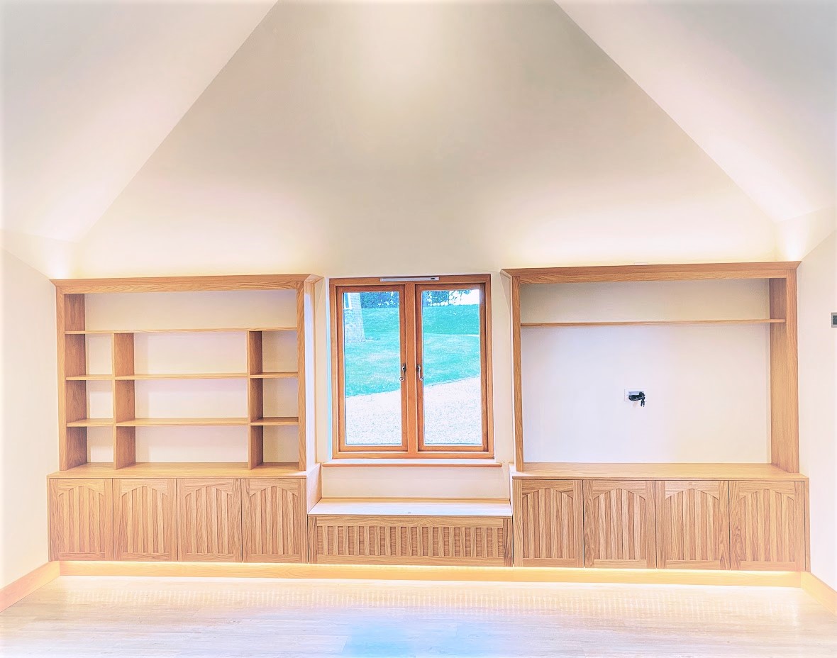 Bespoke oak cabinetry with integrated LED uplighting