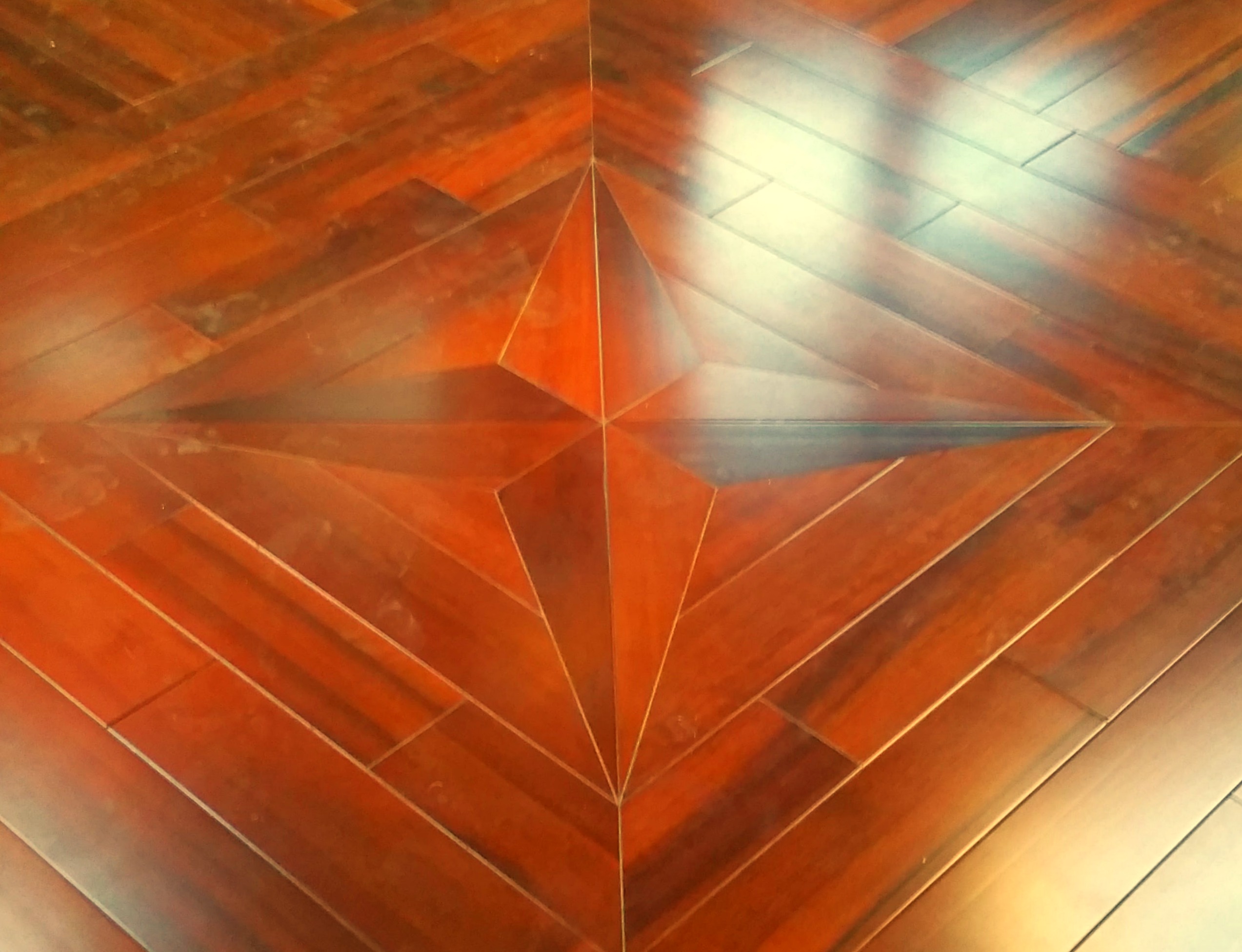 Inlay compass star showing hand-crafted joinery lines