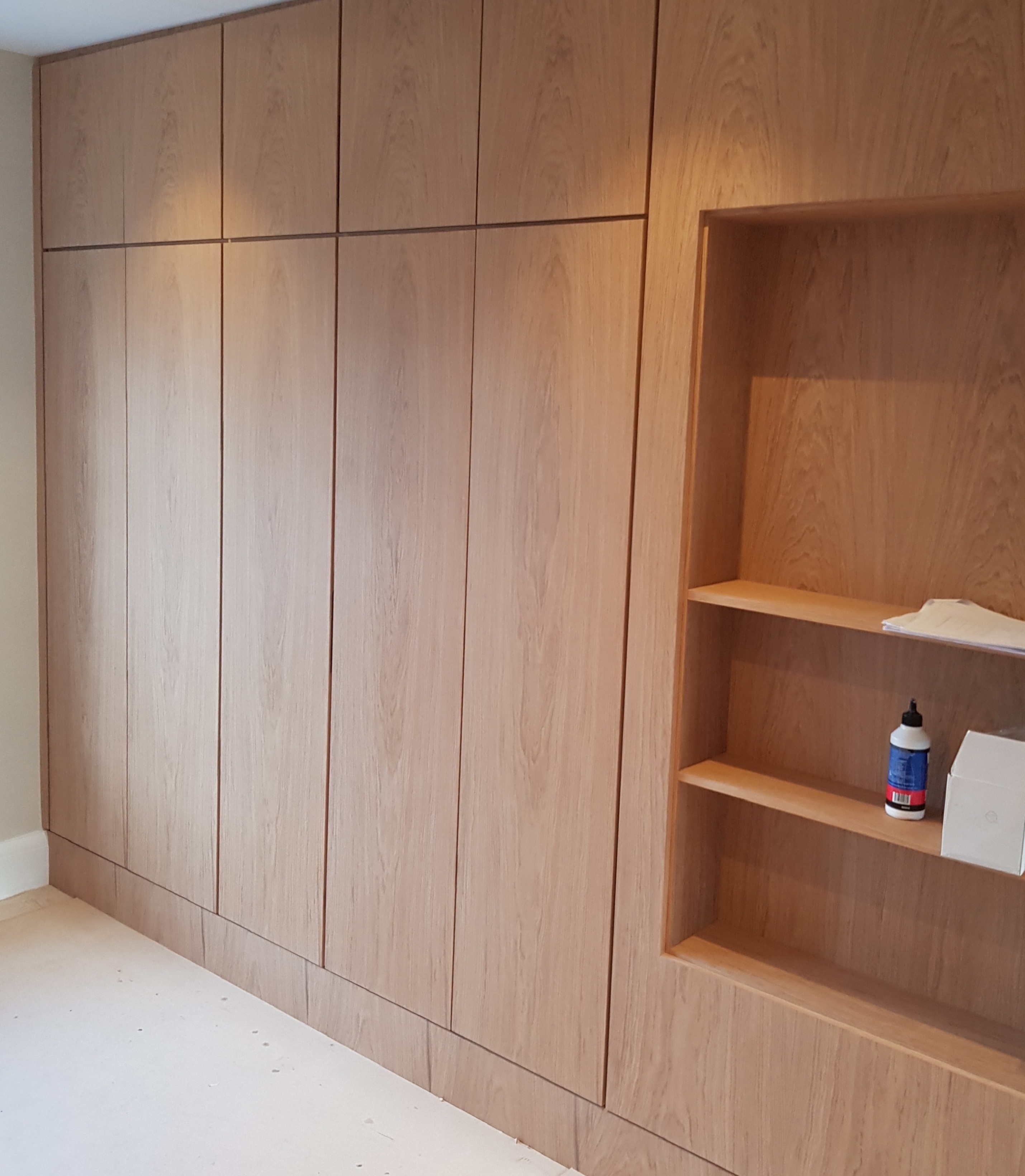 Interior detail of bespoke cabinetry shelving and storage space